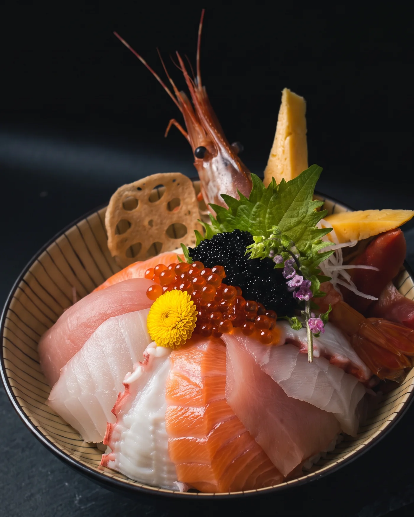 A chirashi don bowl of sashimi over seasoned rice